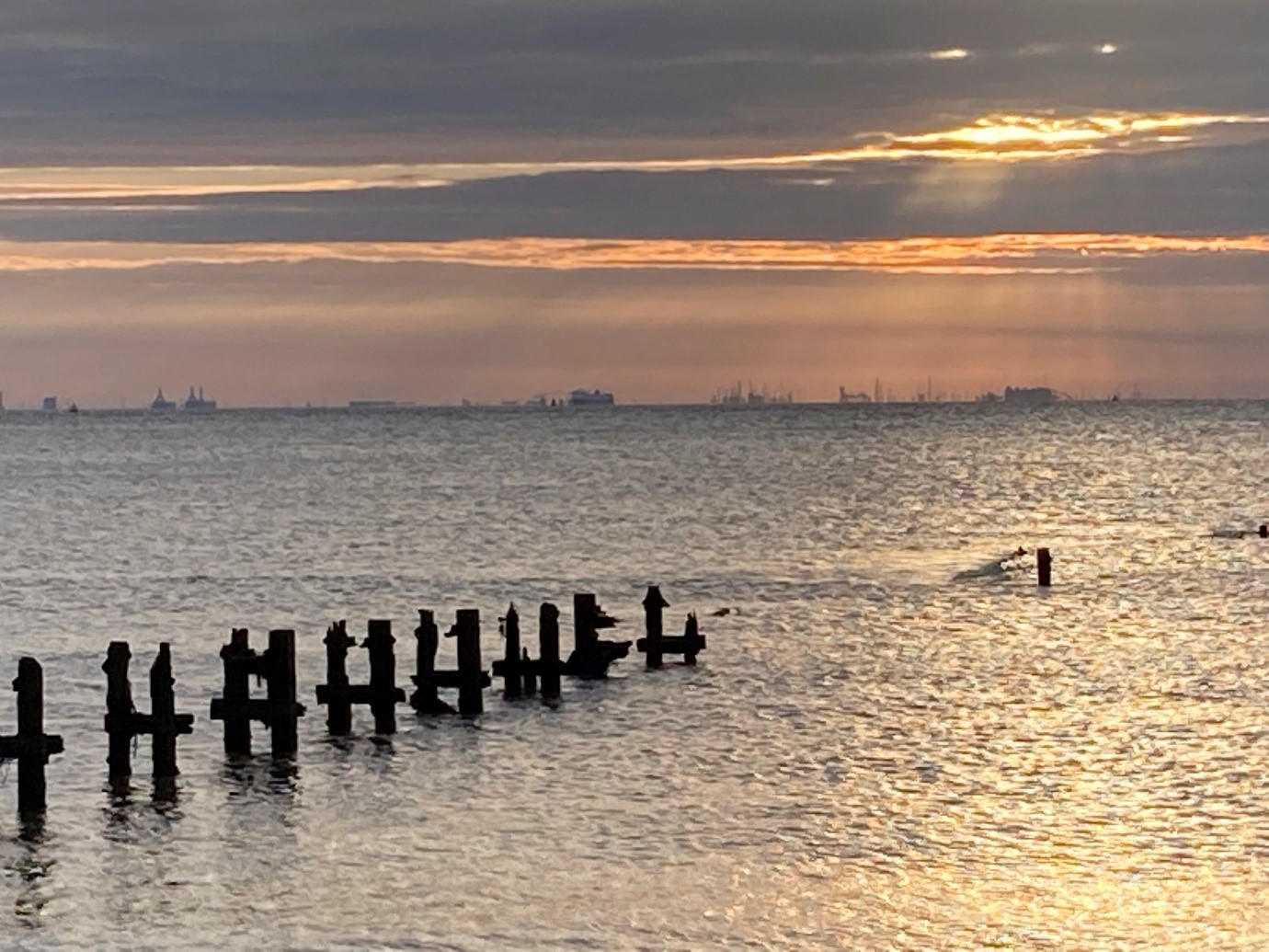 A view from Spurn Point towards the south bank of the Humber showing remnants of a pier