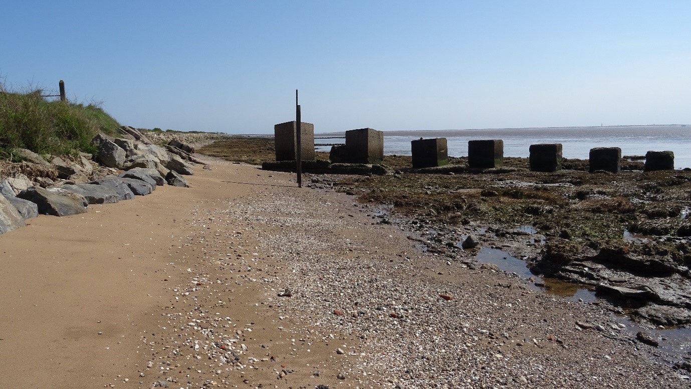 Standing on the banks of the Humber looking towards Spurn with historic concrete defensive structures in view